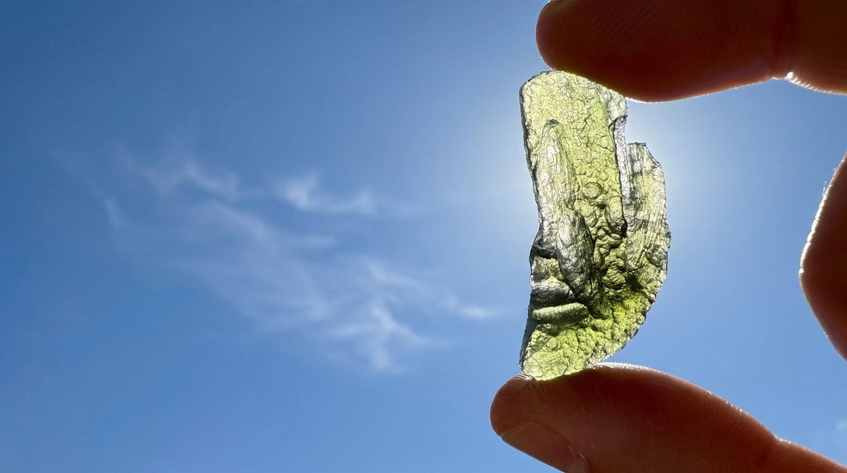 Moldavite held up against the light